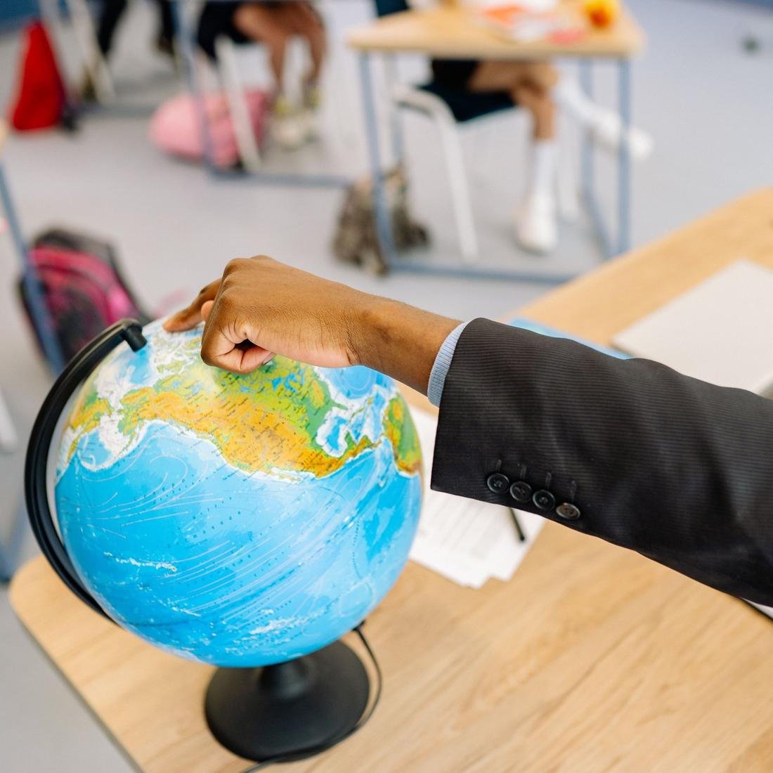 A globe on a classroom desk