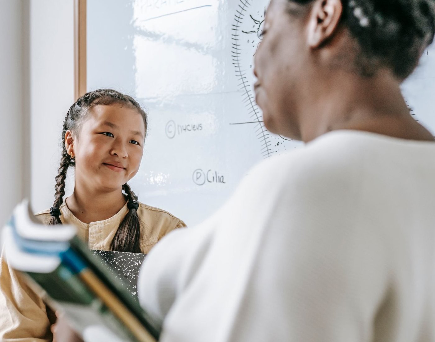 Staff member talking with a pupil