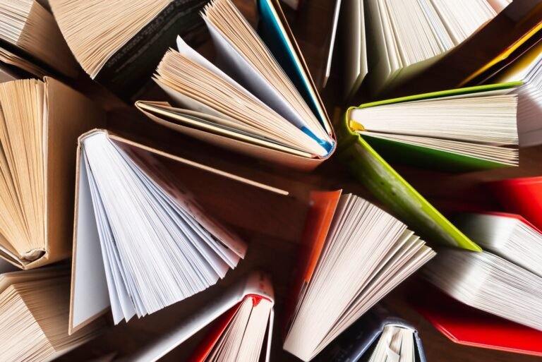 flat lay opened books table scaled 1